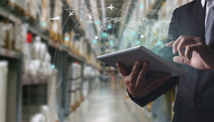Businessman manager using tablet check and control and planning for Modern Trade warehouse logistics,Logistic and transport concept Businessman manager using tablet check and control and planning for Modern Trade warehouse logistics,Logistic and transport concept